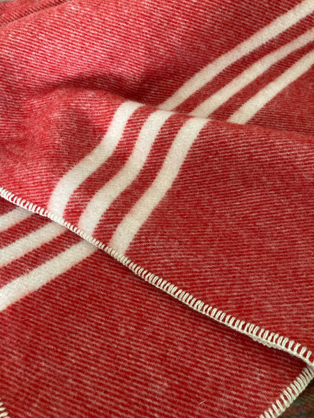 Red wool lap blanket with three cream stripes made in PEI, Canada by MacAusland's Woollen Mills